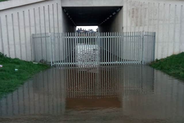 Flood water underneath a Bay Gateway bridge on Thursday. Photo by Greg Lambert.