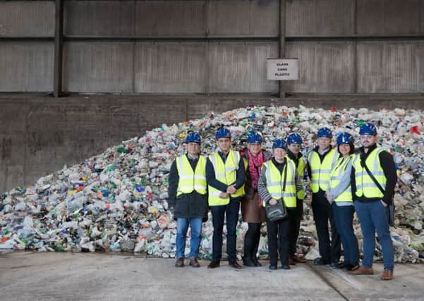Local business leaders (and participants of the Low Carbon Innovation Forum) at the Waste Transfer Centre where they saw the mountain of plastic collected just that morning.