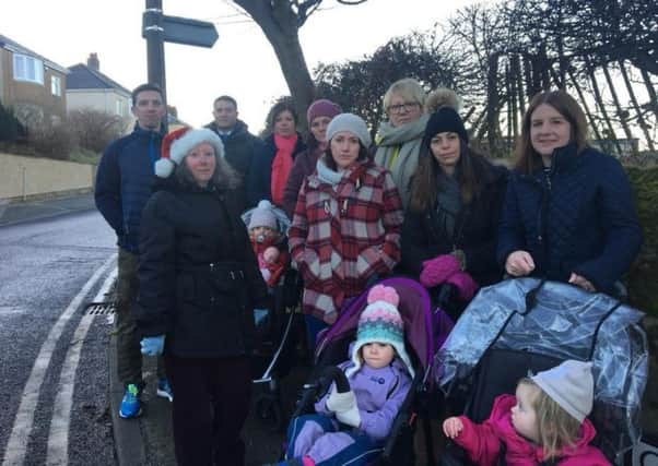 Parents, who have set up the petition, (Ruth Woodhouse centre), outside St Peter's Cof E Primary School in Heysham.