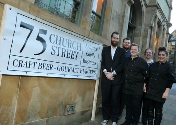 LANCASTER    11-12-17
A new beer and burger bar, 75 Church Street, has opened in Lancaster centre, from left, owner Mark Cutter, Matthew Fitzwilliam, Loren Nott, Becky Dale and Caitlin Walton.