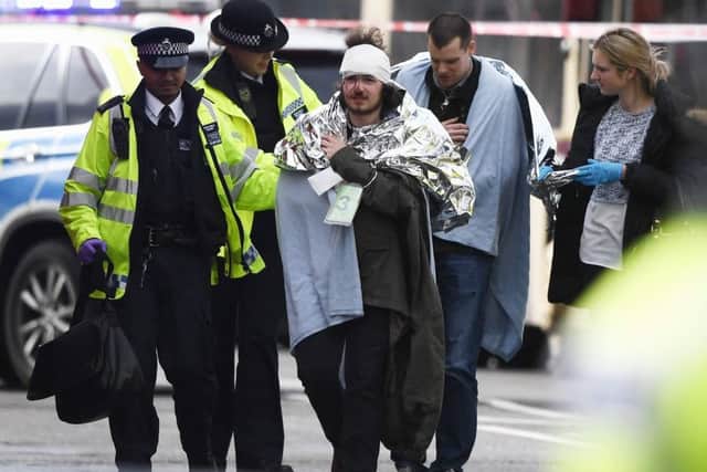 Owen Lambert, 18, from Morecambe, being treated at the scene following the terror attack on Westminster Bridge.