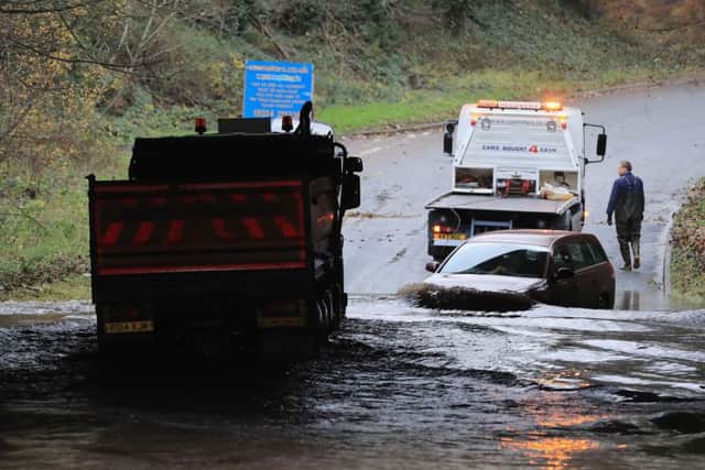 A lorry drives through flood water under a bridge in Galgate, Lancashire, as heavy rain caused widespread flooding and travel disruption across north-west England and North Wales. PRESS ASSOCIATION Photo. Picture date: Thursday November 23, 2017. A number of roads were closed in the area and 27 residents were evacuated from their homes in the village of Galgate, near Lancaster, before sheltering in local pubs overnight. See PA story WEATHER Snow. Photo credit should read: Peter Byrne/PA Wire