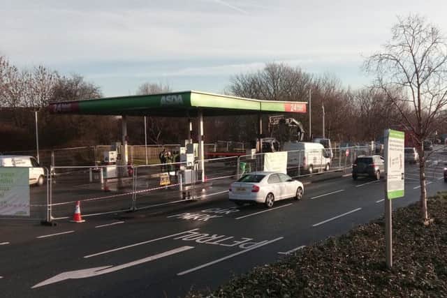 Julie Nicklin's burnt out car being removed from the Asda petrol station on Monday December 18.