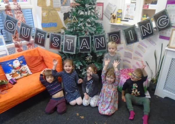 Youngsters at the Pre-School Centre at the University Of Cumbria celebrate their outstanding Ofsted.