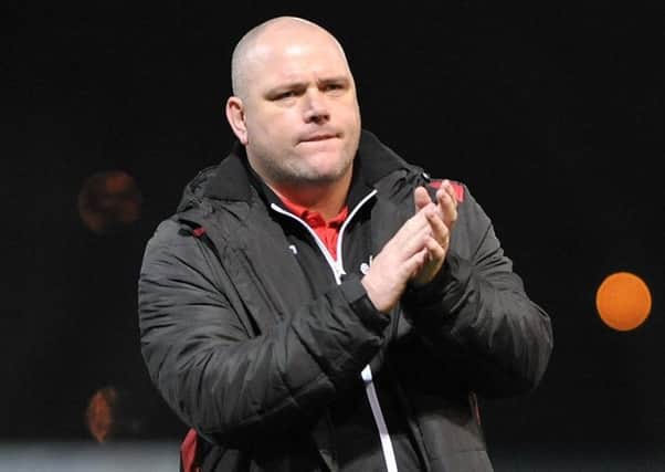 Jim Bentley salutes the Morecambe fans after the defeat at Mansfield. Picture: B&O PRESS PHOTO