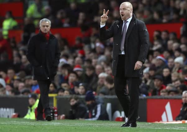 Burnley manager Sean Dyche (right) and Manchester United manager Jose Mourinho on the touchline during the Premier League match at Old Trafford, Manchester. PRESS ASSOCIATION Photo. Picture date: Tuesday December 26, 2017. See PA story SOCCER Man Utd. Photo credit should read: Martin Rickett/PA Wire. RESTRICTIONS: EDITORIAL USE ONLY No use with unauthorised audio, video, data, fixture lists, club/league logos or "live" services. Online in-match use limited to 75 images, no video emulation. No use in betting, games or single club/league/player publications.