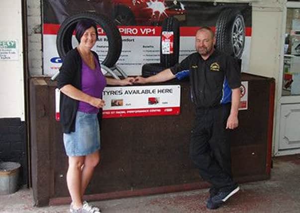 Jane Bailey from Westgate Tyres with her husband Graham.
