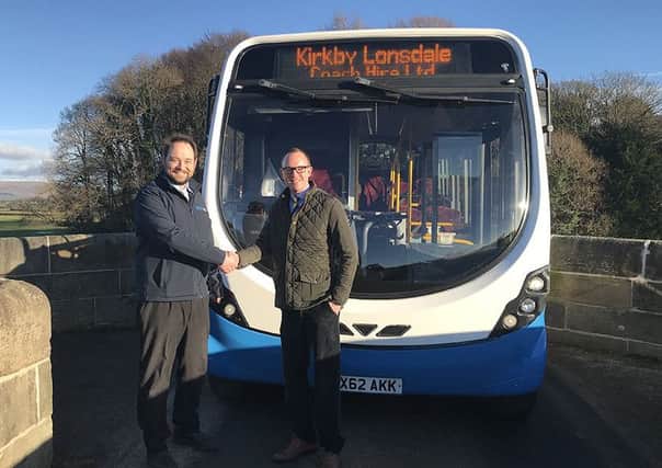 Kirkby Lonsdale Coach Hire Ltd director Matt Sutton with County Councillor Andrew Snowden, lead member for highways and transport.