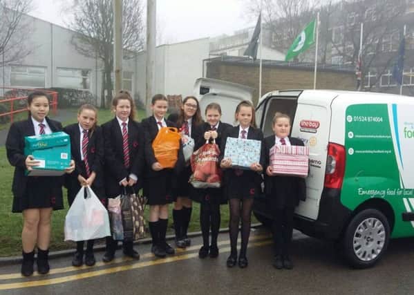 Pupils from Central Lancaster High School with donations for the foodbank