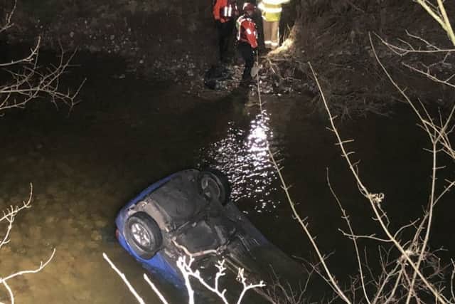 The car in the water at Wrayton. Picture by Lancs Road Police.