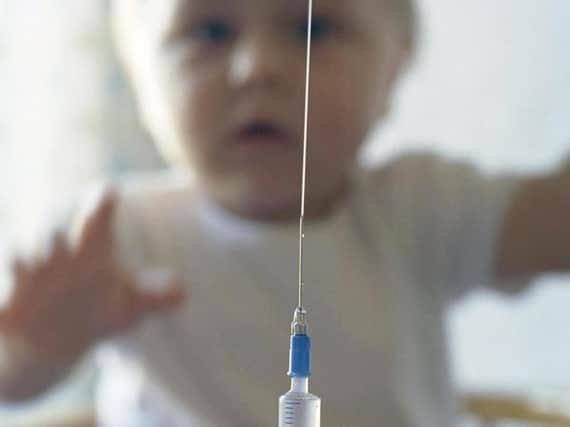 A child getting an immunisation jab.
Photo: Posed by model/PA