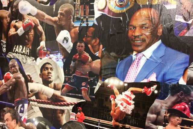 Isaac Lowe takes pride of place on the office wall at Freedom ABC between Anthony Joshua and Mike Tyson.