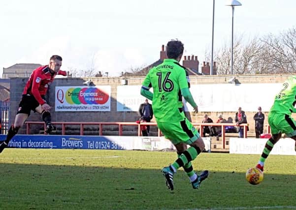 Michael Rose goes for goal against Forest Green Rovers on Saturday.