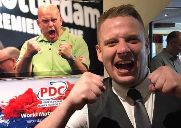 MORECAMBE MUSIC FESTIVAL: Organiser Stuart Michaels celebrates the success of the first Morecambe Music Festival with a little help from world number one darts player Michael van Gerwen!