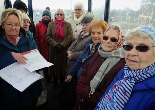 Residents of Stanhope Court in Morecambe are protesting at the axing of their bus service.
Group organiser Mary Hewitt (left) with a petition and other residents at their now-redundant bus stop.  PIC BY ROB LOCK
26-2-2018