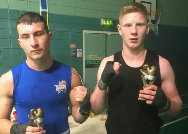 Troy Gallagher (right) with his beaten opponent after their fight on Saturday.