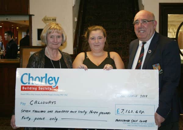 Charlotte Carnell from the Galloways Society is pictured with the cheque alongside Jacqui Dixon and Jim Heap.