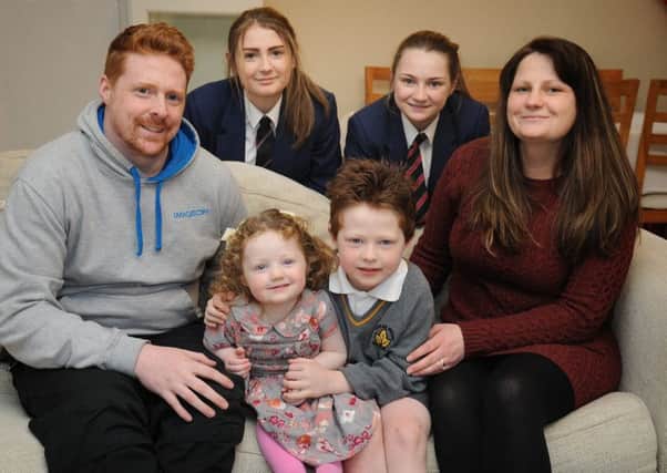 Six year-old Joseph Devaney, of Slyne Road in Lancaster, is now in remission after beating leukaemia. Joseph (centre) with parents Leon and Lindsay, and sisters Amelia (12), Eliza (2) and Caitlyn (15).  Picture by Rob Lock.
