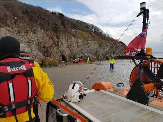 The 70-year-old woman fell approximately 60 feet from the cliff