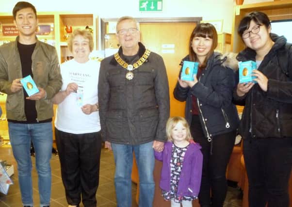Ruth Bruce (Garstang Fairtrader), Cllr Peter Ryder (Garstang mayor) with the Japanese students and their Easter eggs.
