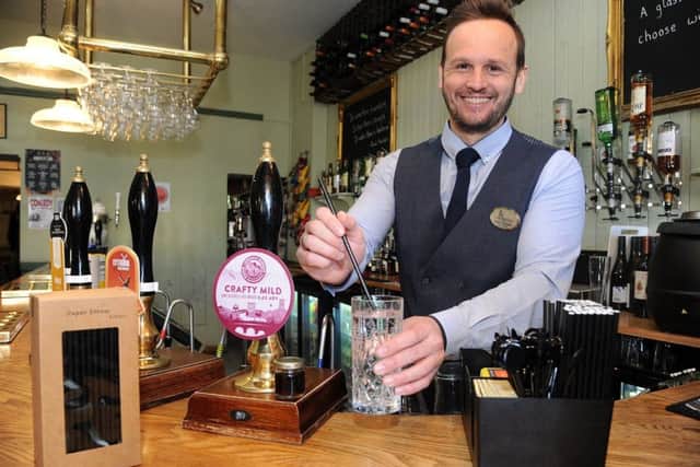 Plastic campaign story on the Borough pub in Dalton Square, where plastic straws have been replaced with paper ones. General Manager Gary Tennant serves a drink with one of the new straws. PIC BY ROB LOCK 19-3-2018