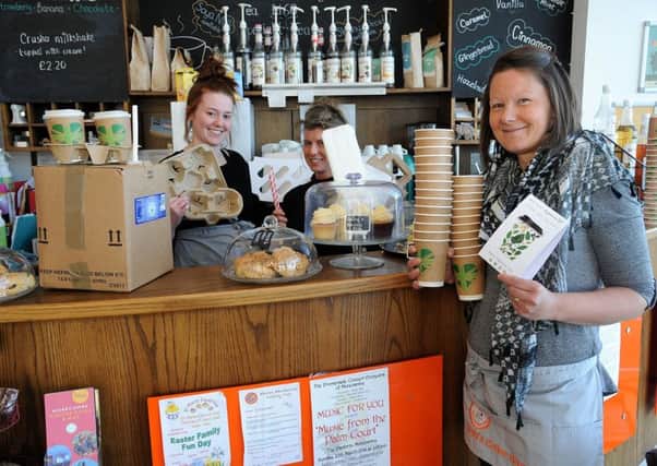 Plastic campaign story at Kerry's Coffee House in Morecambe, which has ditched most of its plastic packaging for paper alternatives. Owner Kerry Brotheridge (right) with Chloe Ford and Priscilla Green with examples of the new packaging. PIC BY ROB LOCK 19-3-2018