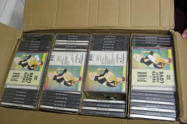 Some of the fake CDs seized.