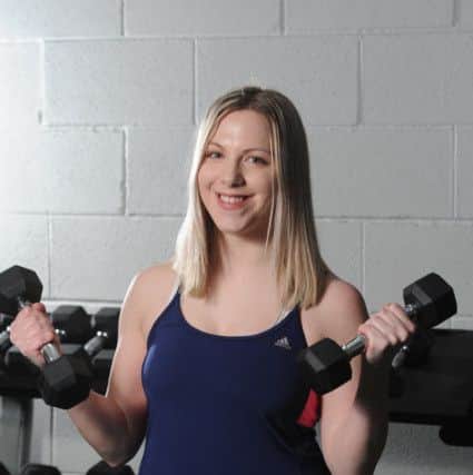 Photo Neil Cross Trainer Lee Jones getting reporter Gemma Sherlock into shape at 3 - 1 -5 gym