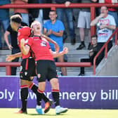 Garry Thompson scored twice in Morecambe's opening day win over Saturday's opponents Cheltenham.