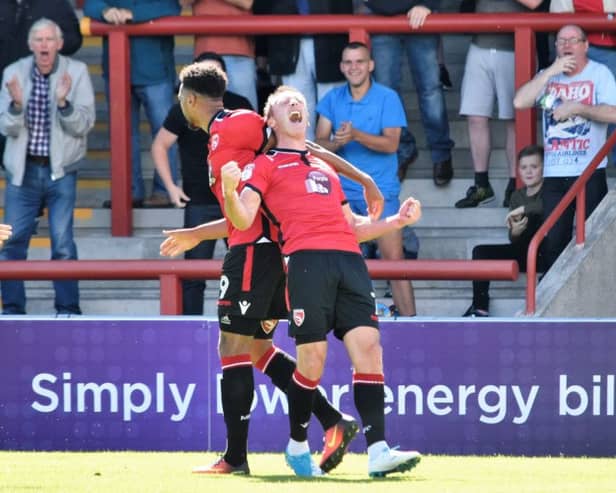 Garry Thompson scored twice in Morecambe's opening day win over Saturday's opponents Cheltenham.