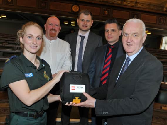 Preston councillor Coun Tony Jones pictured with, from left, paramedic Cheryl Pickstock, and the trio who came to the aid of Tony and gave him CPR, Coun John Fillis, BBC political reporter Mike Stevens and facilities manager Matt Dean