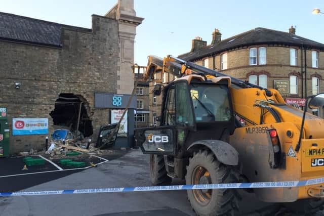 Thieves used a stolen JCB to smash through the building