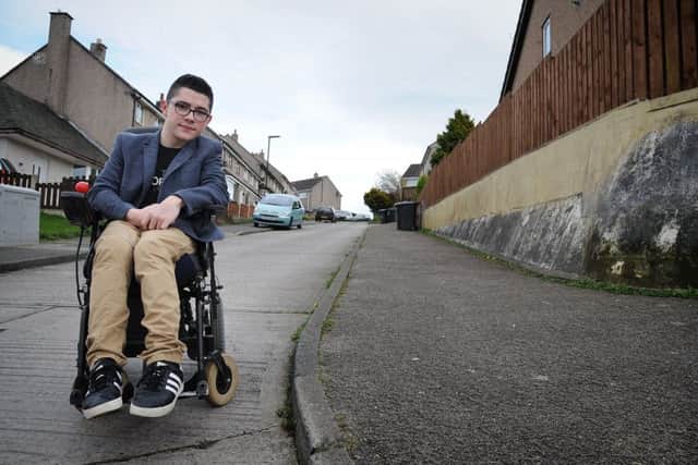 15 year-old cerebral palsy sufferer Cameron Redpath has taken up the problem of disabled access on the Ridge estate in Lancaster with local MP Cat Smith.
Cameron at one of the problem areas.  PIC BY ROB LOCK
3-4-2017