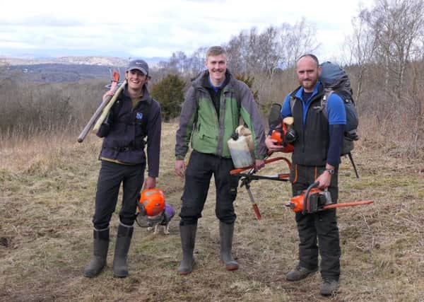 RSPB volunteers Cal Shipton (left) and Connor Duhig (centre) with Estate Worker Richard Smith (right) (credit Jarrod Sneyd)