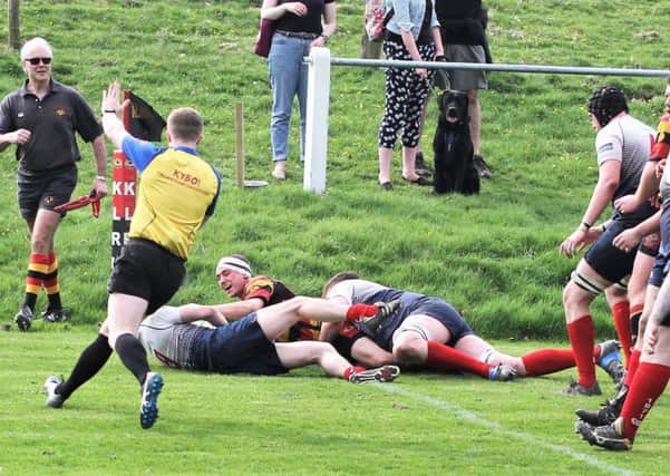 Ben Walker scores a try for Kirkby Lonsdale.