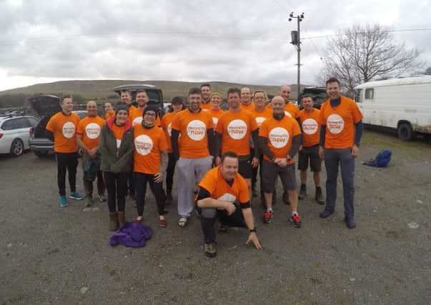 The friends and colleagues of Charlotte and Lee Kirkham at the end of their Yorkshire Three Peaks challenge.