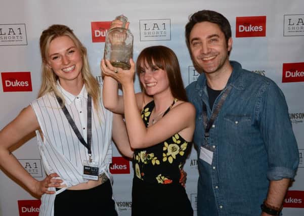 LA1 Shorts film festival co founders Lucie Carrington (left) and Steve Fairclough (right) with last year's winner Izzy Pye and her award. Picture: Darren Andrews.