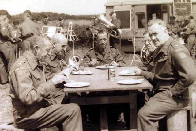 Like a scene out of Dads Army, the officers of Morecambes Home Guard, have their lunch whilst the band starts to practice and other soldiers use a converted railway carriage to store their equipment