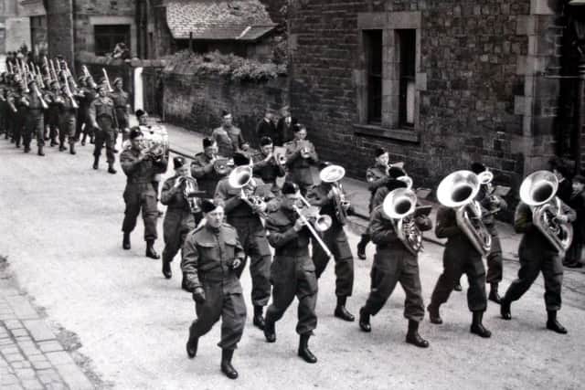 A band leads the Home Guard down Carr House Lane in Lancaster