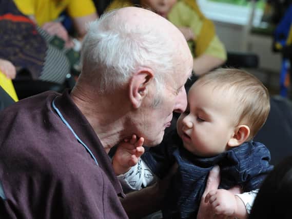 The new Sling Swing classes at Laurel Bank Care Home: Resident James with baby Loki.