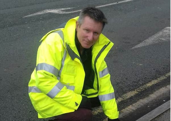 William Maxwell, service development manager, with the plastic kerb in Ribbleton.