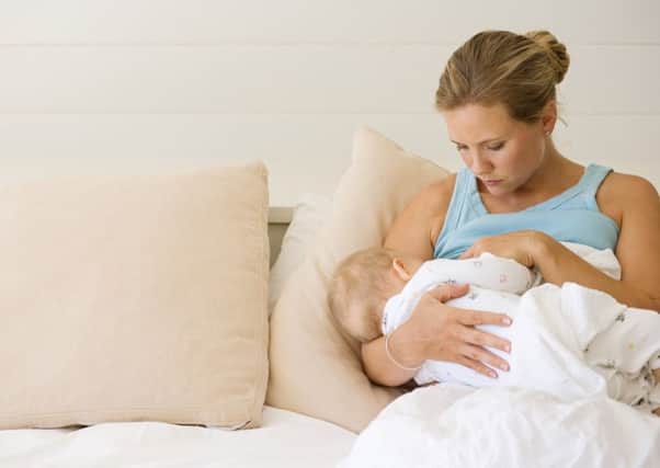 Woman breastfeeding baby