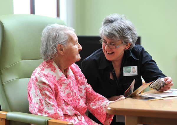 Maureen Platt, a volunteer at Chorley Hospital, in the Rookwood Wing with Betty.