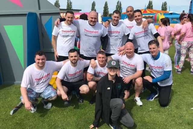 Reece Holt with some of the team who took part in the It's a Knockout event.