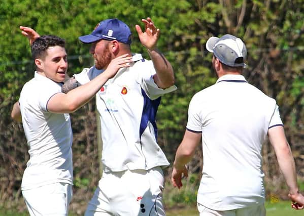 Torrisholme's James Cookson celebrates his wicket. Picture: Tony North