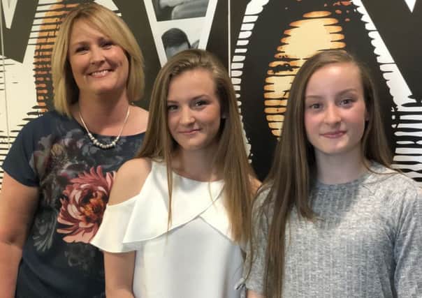 Annette, Caitlin and Erin McNeil from Garstang.  Caittlin and Erin were at the Ariana Grande concert when the Manchester Arena Bomb attack happened. One year on mum Annette has praised local victim support and mental health services for the support they have given her family.