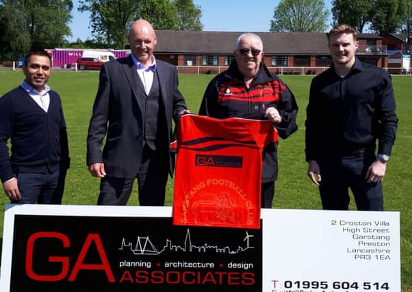 Garstang FC show off their new first-team shirt as the result of a three=year sponsorship deal with GA Associates