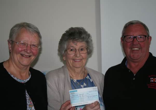 From left: Audrey Bateson and Mary Cottam present a cheque to Morecambe RNLI volunteer Kevin Jackson.